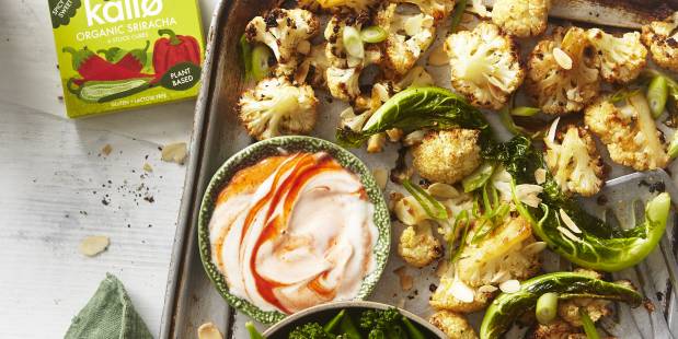 Sriracha roasted cauliflower bites with lemon greens and spicy yogurt dip